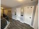 Hallway with wood floors and white doors at 2030 Hydrangea Ln, Austell, GA 30106
