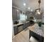 Kitchen with stainless steel appliances, gray cabinetry, granite countertops and backsplash at 2030 Hydrangea Ln, Austell, GA 30106