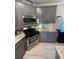 This well-lit kitchen features modern appliances, granite countertops, and gray cabinets at 2030 Hydrangea Ln, Austell, GA 30106