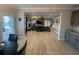 Open floor plan showcases the living room with a fireplace, seamlessly connected to the kitchen at 2030 Hydrangea Ln, Austell, GA 30106