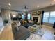 Bright living room features a large sectional sofa, fireplace, and open access to the dining area at 2030 Hydrangea Ln, Austell, GA 30106