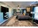 Spacious main bedroom with tray ceiling, a TV, and large dressers for storage at 2030 Hydrangea Ln, Austell, GA 30106