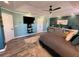 Bedroom featuring dark green walls, tray ceilings, and large dresser for storage at 2030 Hydrangea Ln, Austell, GA 30106