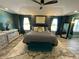 Bedroom with a tray ceiling, and large windows which let in natural light at 2030 Hydrangea Ln, Austell, GA 30106