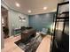 Home office with accent wall, a large desk, shelving, and neutral décor at 2030 Hydrangea Ln, Austell, GA 30106