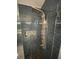 Up close, a shower with blue subway tiles, a rainfall showerhead, and pebble floor at 2030 Hydrangea Ln, Austell, GA 30106
