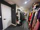 Spacious walk-in closet with ample storage and organization system for clothes, hats, and shoes at 2030 Hydrangea Ln, Austell, GA 30106