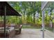 Outdoor deck and seating area with a beautiful wooded view at 2332 Leacroft Way, Marietta, GA 30062