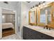 Dual sink vanity area with stylish mirrors and bathroom fixtures at 2332 Leacroft Way, Marietta, GA 30062