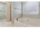 Bright bathroom featuring a soaking tub and separate shower at 2332 Leacroft Way, Marietta, GA 30062