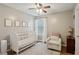 Bedroom with crib, comfortable chair, and charming decor at 2332 Leacroft Way, Marietta, GA 30062
