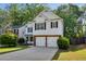 Charming two-story home with a well-manicured lawn and a two-car garage at 2332 Leacroft Way, Marietta, GA 30062