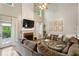Spacious living room with fireplace, large windows, and comfortable seating at 2332 Leacroft Way, Marietta, GA 30062