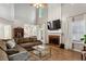 Spacious living room features a fireplace and large sectional sofa at 2332 Leacroft Way, Marietta, GA 30062