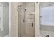 Bathroom shower with glass door and white tiling at 2332 Leacroft Way, Marietta, GA 30062