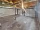 Spacious unfinished basement, with a sealed wall, providing a blank canvas for storage or future customization at 294 Farm Ridge Ne Dr, Woodstock, GA 30188