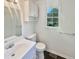 Updated bathroom featuring white fixtures, and natural light from a window at 294 Farm Ridge Ne Dr, Woodstock, GA 30188
