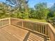 The home features a lovely, well-maintained wooden deck with a backyard and natural green surroundings at 294 Farm Ridge Ne Dr, Woodstock, GA 30188