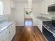 Updated kitchen featuring stainless steel appliances, white cabinets, and granite countertops at 294 Farm Ridge Ne Dr, Woodstock, GA 30188