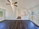 A living room featuring hardwood floors, natural light, a ceiling fan and access to other rooms at 294 Farm Ridge Ne Dr, Woodstock, GA 30188