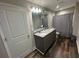 Bathroom with double sink vanity and shower with gray curtain at 3407 Hidden Stream Ct, Stockbridge, GA 30281