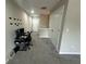 Long hallway with carpet and access to closets at 3407 Hidden Stream Ct, Stockbridge, GA 30281