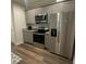 Updated kitchen featuring stainless steel appliances and grey cabinetry at 3407 Hidden Stream Ct, Stockbridge, GA 30281