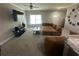 Inviting living room with a large sectional sofa and entertainment center at 3407 Hidden Stream Ct, Stockbridge, GA 30281