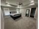 Spacious main bedroom with trey ceiling, carpet, and plenty of natural light at 3407 Hidden Stream Ct, Stockbridge, GA 30281