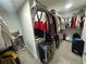Organized walk-in closet with shelving and ample hanging space at 3407 Hidden Stream Ct, Stockbridge, GA 30281