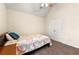 Serene bedroom features neutral tones, vaulted ceiling, and a large closet for ample storage at 517 Dasheill Ln, Atlanta, GA 30349