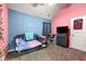 Brightly colored bedroom featuring a unique two-tone paint scheme and vaulted ceilings at 517 Dasheill Ln, Atlanta, GA 30349