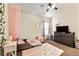 Bedroom with carpet, curtains, ceiling fan, and pink canopy at 517 Dasheill Ln, Atlanta, GA 30349