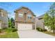 Charming home with a brick and siding exterior, attached two-car garage, and well-kept lawn at 517 Dasheill Ln, Atlanta, GA 30349