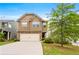 Two-story home with a two-car garage, neutral siding, a brick facade, and a well-manicured lawn at 517 Dasheill Ln, Atlanta, GA 30349