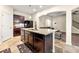 Spacious open kitchen with granite countertops, an island, dark cabinetry, and an open floorplan at 517 Dasheill Ln, Atlanta, GA 30349