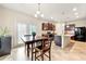 Eat-in kitchen featuring granite countertops, dark cabinets, stainless steel appliances, and breakfast area at 517 Dasheill Ln, Atlanta, GA 30349