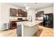 Beautiful kitchen with a center island, granite countertops, stainless steel appliances, and ample cabinet space at 517 Dasheill Ln, Atlanta, GA 30349