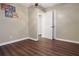 Bedroom showcases wood-look floors, neutral walls, and convenient access to other rooms at 1083 Grace Dr, Forest Park, GA 30297