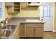 Galley style kitchen features granite counters, a double sink, and modern appliances at 1083 Grace Dr, Forest Park, GA 30297