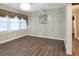 Inviting living area featuring hardwood floors, neutral wall colors, and a bright window at 1083 Grace Dr, Forest Park, GA 30297