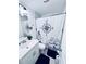 Bathroom featuring a white vanity, black rug, toilet and shower with nautical curtain at 1298 Gideons Sw Dr, Atlanta, GA 30314
