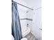 Clean bathroom featuring a bathtub, tiled walls, modern fixtures, and a shower perfect for relaxing at 1298 Gideons Sw Dr, Atlanta, GA 30314