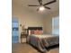 Bedroom featuring a queen bed, ceiling fan, and natural light at 1298 Gideons Sw Dr, Atlanta, GA 30314