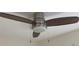 Close up of ceiling fan with lighting and silver/grey finish at 1298 Gideons Sw Dr, Atlanta, GA 30314