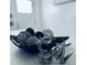 Stylish decorative elements showcased: woven balls in a dark dish with a metallic sign at 1298 Gideons Sw Dr, Atlanta, GA 30314