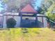 Home on a hill with a cozy porch and manicured lawn at 1298 Gideons Sw Dr, Atlanta, GA 30314
