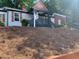 Charming home featuring a lovely covered porch and nicely landscaped yard with mature trees at 1298 Gideons Sw Dr, Atlanta, GA 30314
