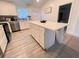 Bright kitchen featuring white cabinets, stainless steel appliances, and a large island at 1298 Gideons Sw Dr, Atlanta, GA 30314