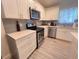 Modern kitchen with stainless steel appliances, gray subway tile backsplash, and white countertops at 1298 Gideons Sw Dr, Atlanta, GA 30314